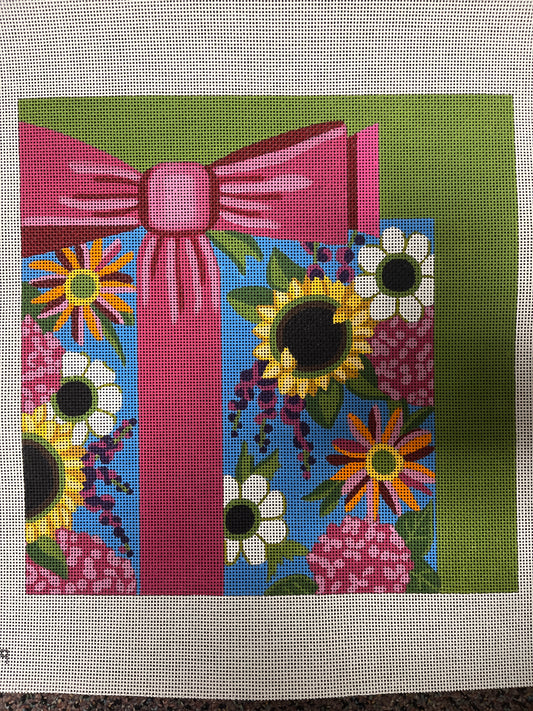 Floral gift with pink bow